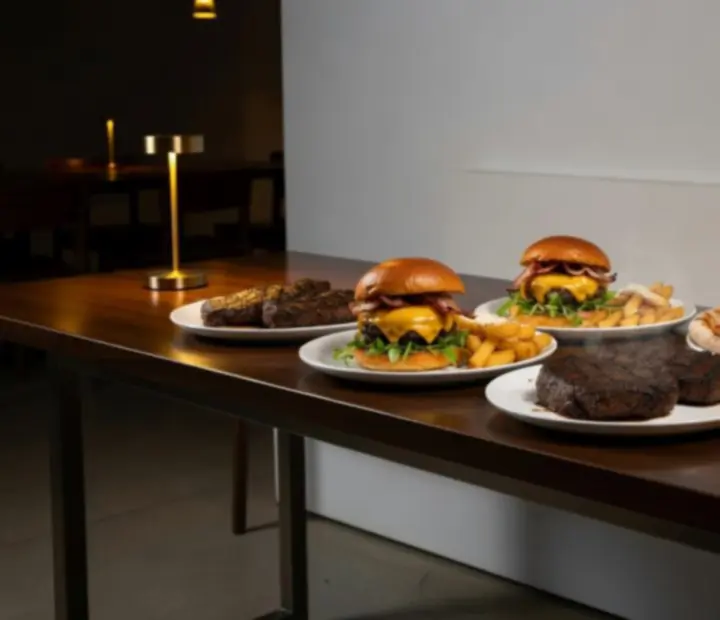Table filled with seasonal Australian dishes and drinks for late-night dining